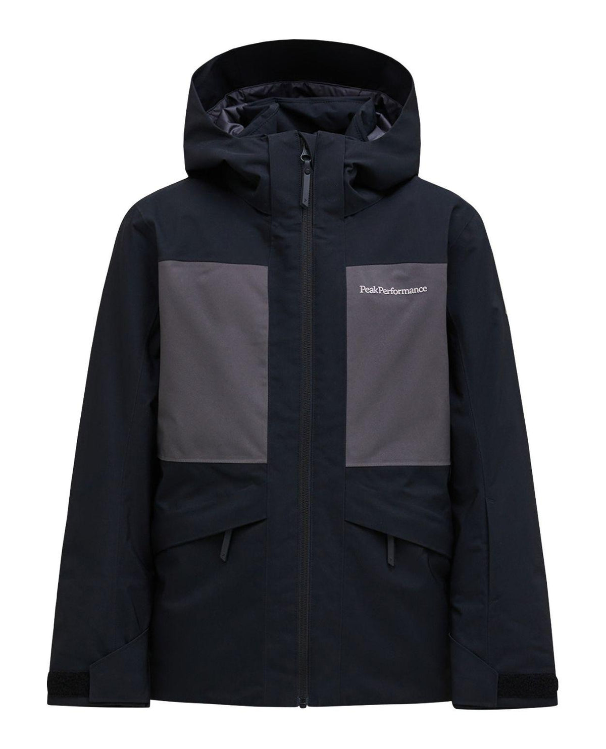 Peak Performance Gravity Insulated Jacket Junior i svart och motion grey för unga skidåkare.