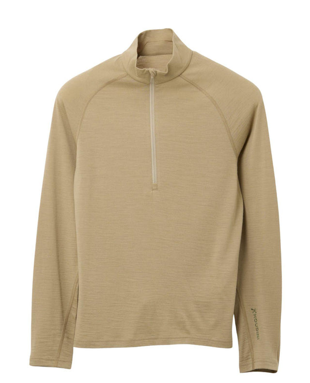 Houdini Puremerino Halfzip damunderställ i färgen powder green mot vit bakgrund.