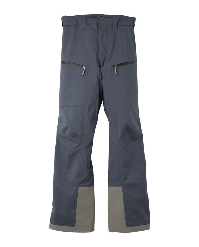 Houdini Ride Pants II dam i färgen blå framifrån, med dragkedjeförsedda fickor och förstärkningar vid bensluten.