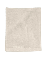 Beige fleecefoddrad halsvärmare från Houdini med diskret logotyp nedtill.