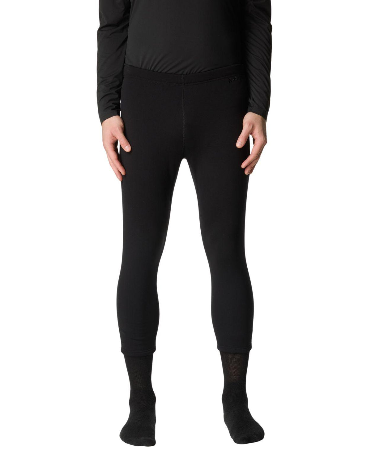 En person bär svarta Houdini Drop Knee Power Tights II underställsbyxor för herrar.