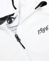 Peak Performance 40Y Rider Zip Hood dam i offwhite, närbild på dragkedja, detaljer och tryck.