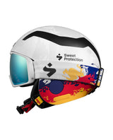 Sweet Protection Clockwork MAX RIG Reflect TE skidglasögon med tillhörande hjälm i satin white och flerfärgad design.