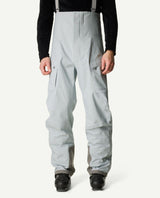 Houdini Rollercoaster Bib Pants i ljusgrått för herrar med hängslen och pjäxor.