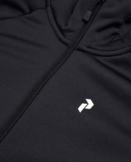 Närbild på Peak Performance Rider Essentials Zip Hood Junior i svart med dragkedja och vit logotyp.
