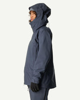 Houdini Ride Jacket i dammodell i färgen blå som ses från sidan.