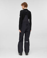 Mammut Eiger Free Pro HS Bib Pants Women i svart modell bakifrån på skidåkare.