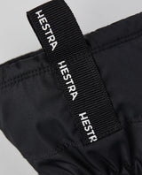 Hestra Gore-Tex Gauntlet Junior Mitt - Svart tumhandske med logotryck på kragen.