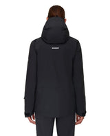 Mammut Haldigrat HS Hooded Jacket Men i svart färg visad bakifrån på skidåkare.