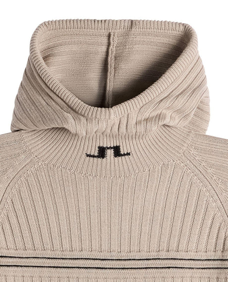 Detaljbild på hals och huva av J.Lindeberg Hilda Knitted Rib Hoodie dam i beiget stickat material.