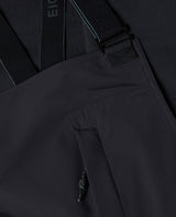 Mammut Eiger Free Pro HS Bib Pants dam i svart färg som visar detaljer på hängslen och bröstficka.