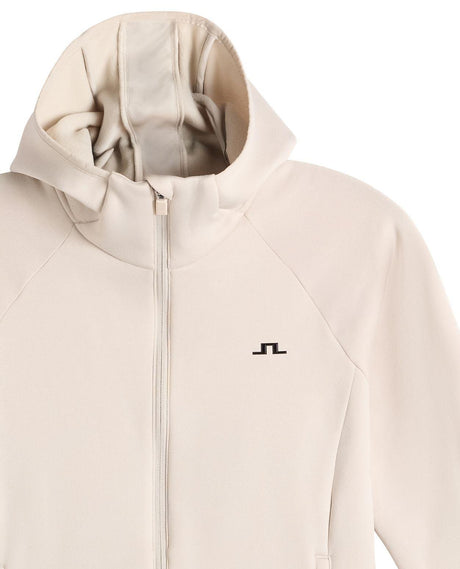 Närbild på huva och bröstparti av J.Lindeberg Portia Polartec Hood dam i beige färg.