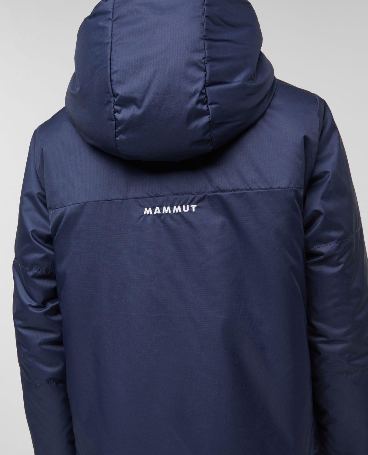 Mammut Waymarker IN Reversible Hooded Jacket Junior bakifrån i mörkblå design med huva och logotyp.